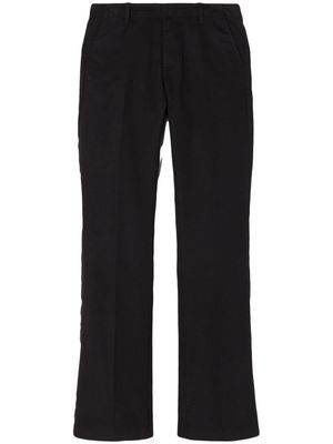 RE/DONE pressed-crease cotton-blend flared trousers - Black