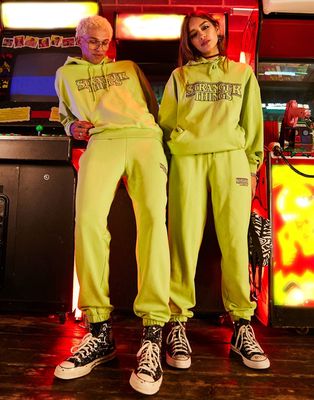 Reclaimed Vintage x Stranger Things unisex sweatpants in washed yellow with logo-Multi