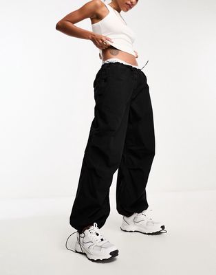 River Island low rise parachute cargo pants in black