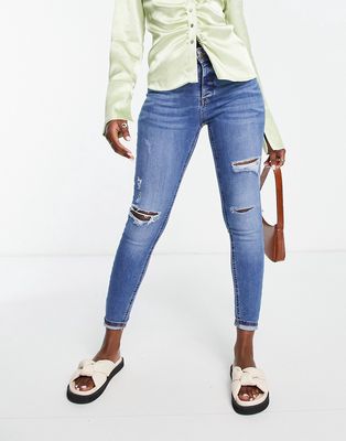 River Island mid rise skinny jeans with rips in dark blue