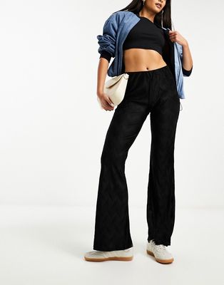 River Island plisse flare pants In black - part of a set