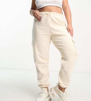 River Island Plus cargo pants with pocket detail in beige-Neutral