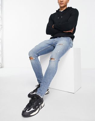 River Island spray on ripped jeans in blue
