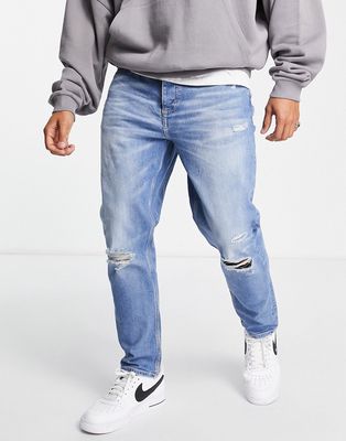 River Island tapered jeans with rips in light blue