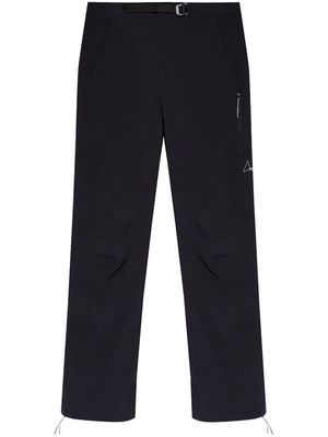 ROA logo-engraved tapered trousers - Black