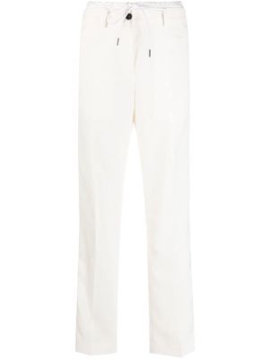 sacai pressed-crease drawstring-waist trousers - White
