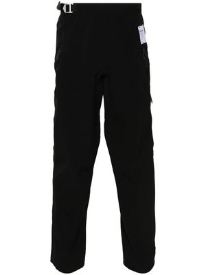 Satisfy PeaceShell™ logo-print trousers - Black