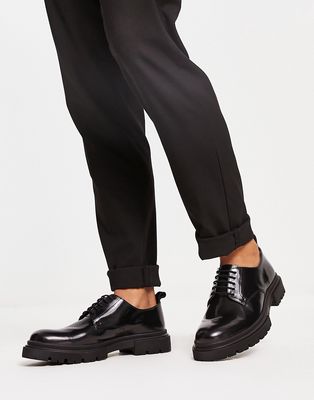 schuh Poet chunky lace up shoes in black hi-shine leather