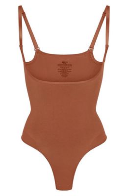 SKIMS Seamless Sculpt Open Bust Thong Bodysuit in Bronze