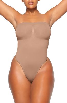 SKIMS Seamless Sculpt Strapless Bodysuit in Sienna