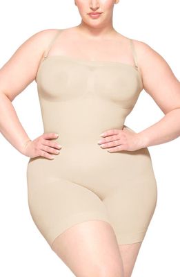 SKIMS Seamless Sculpt Strapless Shortie Bodysuit in Sand