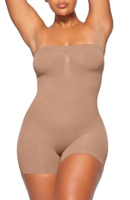 SKIMS Seamless Sculpt Strapless Shortie Bodysuit in Sienna