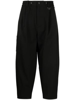 SONGZIO logo-embroidered pleated drop-crotch trousers - Black