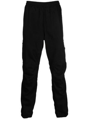 Stone Island logo-patch tapered trousers - Black