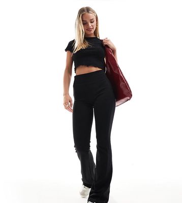 Stradivarius Petite deep waistband sculpt flared pants in black