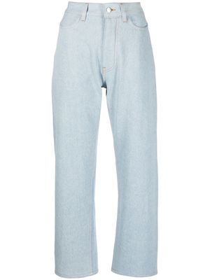 Studio Nicholson light-wash cropped denim trousers - Blue