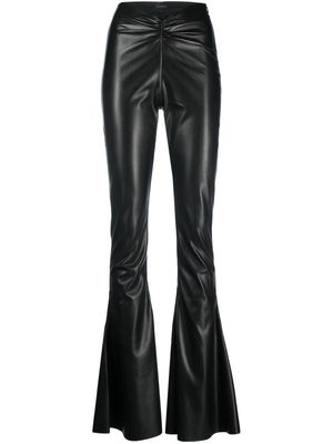 THE ANDAMANE flared faux-leather trousers - Black