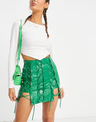 The Couture Club lace up leather look mini skirt in green