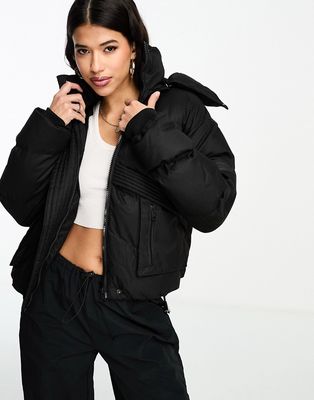 The Couture Club oversized cropped puffer jacket in black with tie hem