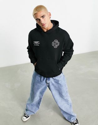 The Couture Club oversized hoodie in black with emblem and script logo print