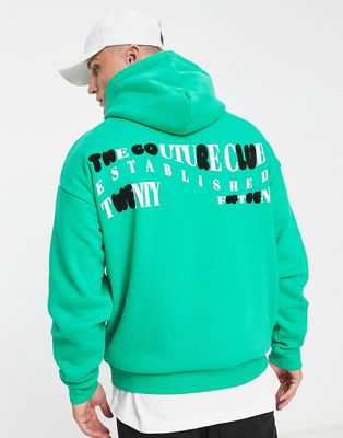 The Couture Club oversized pullover hoodie in green with boucle detail back print