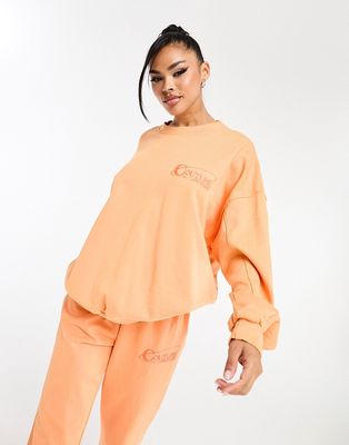 The Couture Club oversized sweatshirt with back print in orange - part of a set