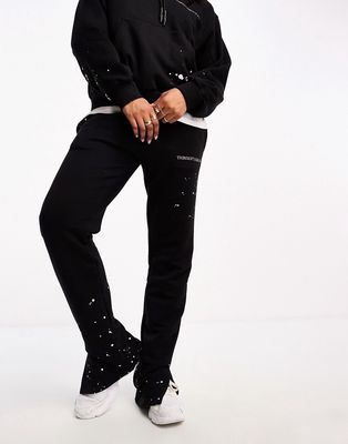 The Couture Club paint splatter straight leg sweatpants in black