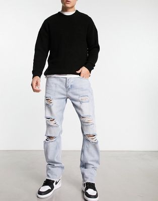 The Couture Club straight leg denim jeans in midwash blue with ripped knee detail