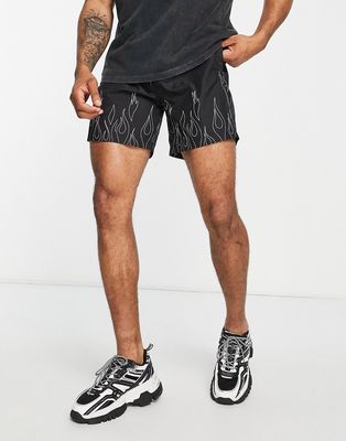 The Couture Club swim shorts in black with flame outline print