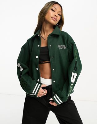 The Couture Club varsity collared jacket in dark green with logo badging