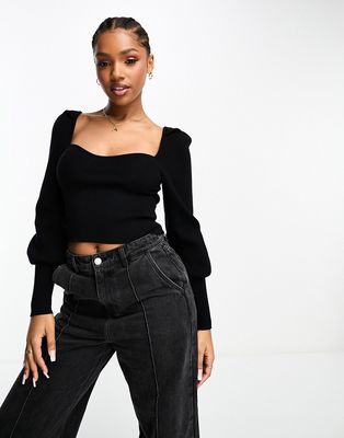 The Frolic rib detail long sleeve cropped sweater in black
