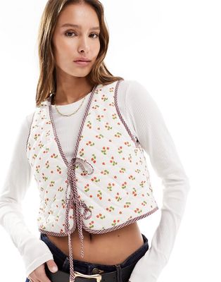 The Frolic strawberry print reversible quilted vest in multi