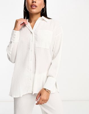 The Frolic tourmaline shirred long sleeve beach shirt in white pleated texture - part of a set