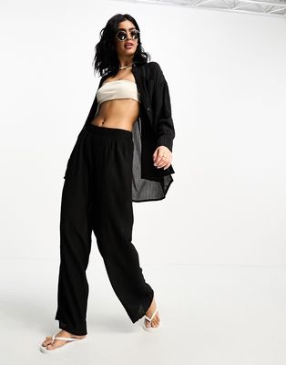 The Frolic tourmaline shirred wide long pants in black pleated texture - part of a set