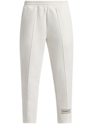 THE GIVING MOVEMENT logo-appliqué tapered track pants - White