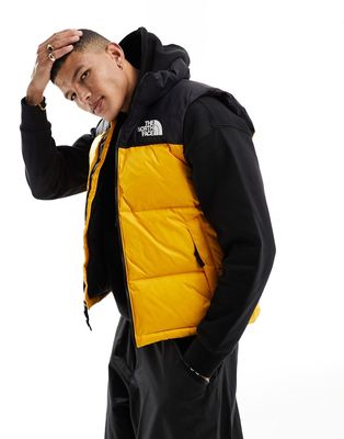 The North Face '96 Retro Nuptse down puffer vest in yellow and black