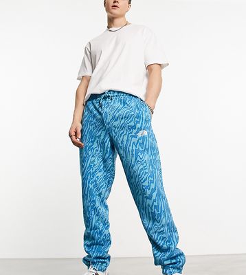 The North Face Essential oversized sweatpants in blue marble print Exclusive at ASOS