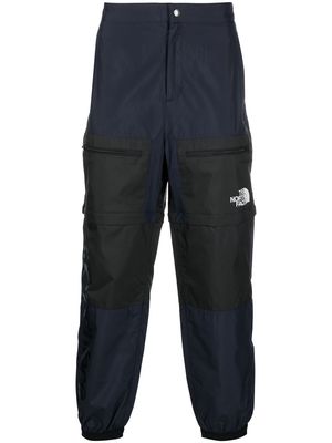 The North Face logo-print tapered trousers - Blue