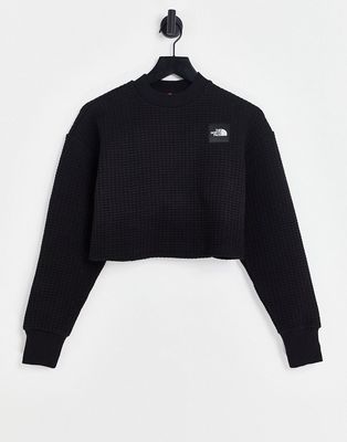 The North Face Mhysa quilted long sleeve crop top in black