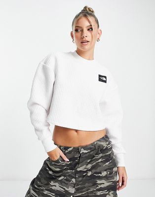 The North Face Mhysa quilted long sleeve crop top in white