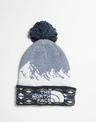 The North Face pom beanie in blue and white