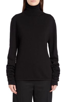The Row Carlus Virgin Wool Turtleneck Sweater in Black