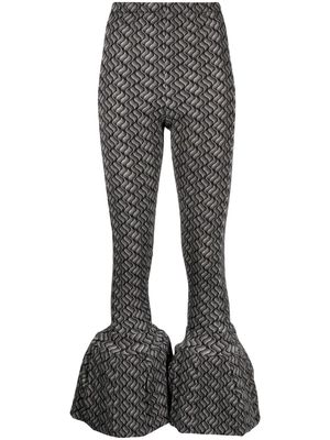 Toga geometric-print flared trousers - Black