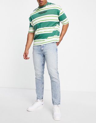 Tommy Jeans dad regular tapered fit jeans in light wash-Blue