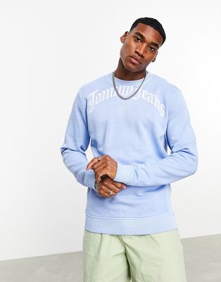 Tommy Jeans relaxed grunge arch logo crewneck sweatshirt in light blue