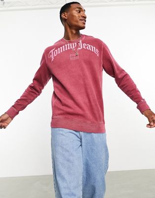 Tommy Jeans relaxed grunge arch logo crewneck sweatshirt in red