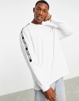 Tommy Jeans tape logo long sleeve t-shirt in white