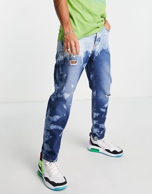 Topman relaxed extreme wash jeans in mid wash blue