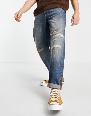 Topman relaxed rip and repair jeans in dark mid wash blue-Blues