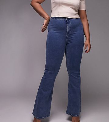 Topshop Curve Joni flare jeans in mid blue